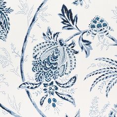 a blue and white wallpaper with floral designs