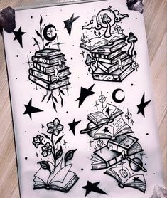 a drawing of books and stars on a sheet of paper