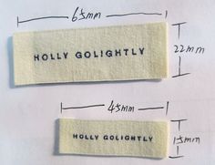 two pieces of cloth with words on them are labeled in black and white, along with measurements for each piece