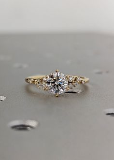 an engagement ring with three stones on it