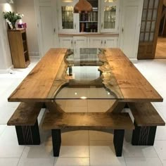 a large wooden table with two benches in front of it