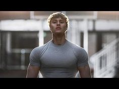 a man standing in front of some stairs