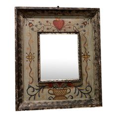 an old wooden frame with a mirror on it