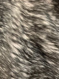 an animal fur texture is shown in grey and white