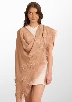 Indulge in the ultimate opulence with this fawn scarf woven from the finest cashmere. Wrap yourself in this statement piece elevated by its handcrafted tonal pearl-embroidered daisy flowers, exotic lavender lace panels and an fawn frill detailing on one side. This scarf brings with it a sense of timeless beauty, perfectly blending luxurious warmth and refined elegance. It is the ideal accessory to make heads turn on any formal evening out or a special occasion. Elegant Beige Wool Scarf, Elegant Cashmere Shawl, Elegant Floral Embroidered Dupatta, Elegant Floral Embroidered Shawl Scarves, Elegant Floral Embroidered Shawl Scarf, Elegant Floral Embroidery Shawl Scarves, Elegant Cream Embroidered Shawl, Elegant Embroidered Silk Scarves, Luxury Pashmina Shawl Scarf