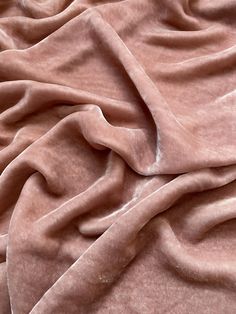 a close up view of a pink blanket