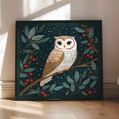 an owl is sitting on a tree branch with berries and leaves painted on it's back