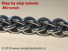 a metal chain with the words step by step tutorial mirrored on top of it