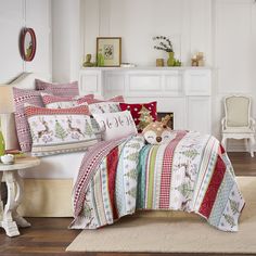 a bed room with a neatly made bed and christmas decorations on the wall above it