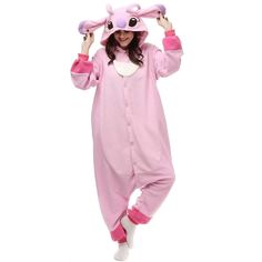 a woman in a pink animal onesuit is holding her hands up to her head