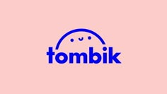 the word tombik is written in blue on a pink background