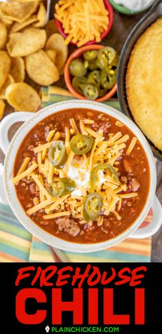 a bowl of chili with cheese and jalapenos next to other bowls of nachos