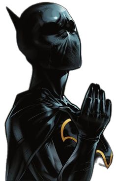 a black batman standing with his hands in the air