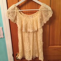 Brand New Never Worn Forever 21 Lace Top In Size Small. Can Be Worn On Or Off Shoulder. Comes With A Tie That Can Be Used To Make A Cinched Look. Color Is A Creamish Ivory. Lace Off Shoulder Top, Forever 21 Tops Blouses, Off Shoulder Top, Forever21 Tops, Ivory Lace, Off Shoulder Tops, Forever 21 Tops, Shoulder Top, Off Shoulder