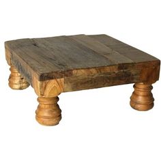 a wooden coffee table with two legs and a square top on an isolated white background