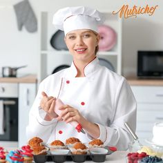 a woman in a chef's outfit is preparing cupcakes