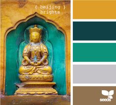 the color scheme is green, yellow and brown with gold buddha statue in front of it