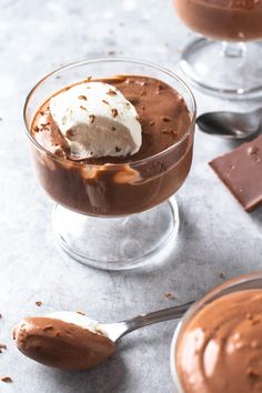 two glasses filled with chocolate pudding and ice cream