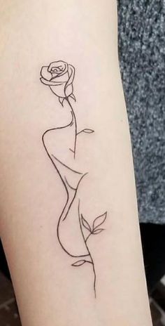 a woman's arm with a rose tattoo on the left side of her body