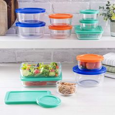 several plastic containers with food in them on a shelf