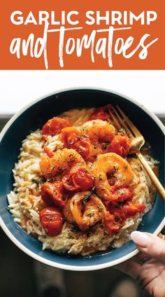 garlic shrimp and tomatoes on top of rice in a bowl