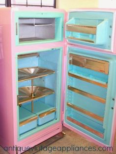 two pink and blue refrigerators sitting next to each other