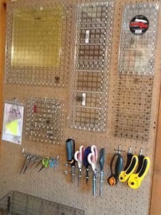 there are many tools on the peg board