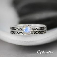 a close up of a ring with a stone in it