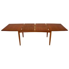 a wooden table with four leaves on it