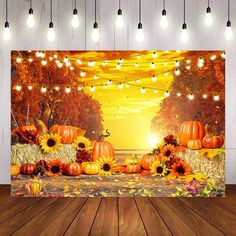 an autumn scene with pumpkins and sunflowers