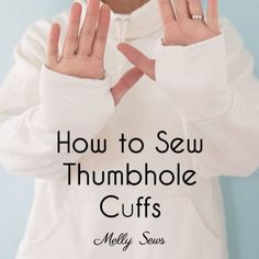 a person with their hands in the shape of a heart and two fingers out to spell how to sew thumbhole cuffs