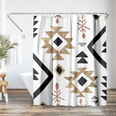 a shower curtain with an abstract design in gold, black and white on the outside