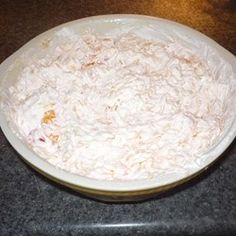 a bowl filled with food sitting on top of a counter