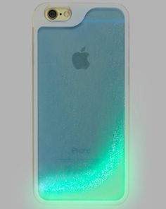 an iphone case that is glowing in the dark, with a green light behind it