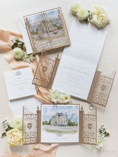 the wedding stationery is laid out on top of each other