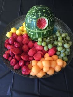 a star wars themed fruit platter with watermelon, grapes, and strawberries