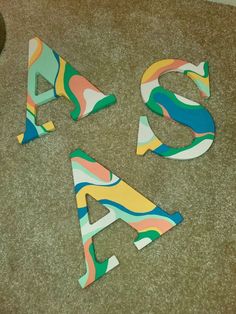 the letters are cut out and placed on the floor to make an art project for kids