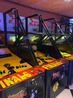 several arcade machines lined up in a row