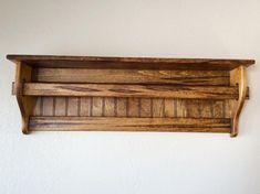 a wooden shelf mounted on the wall