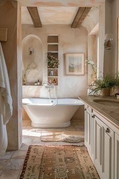 a bath room with a tub a sink and a rug on the floor in front of it