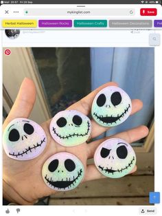 someone is holding out their hand with four fake faces painted on the inside of them