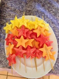 there are many stars on the plate and toothpicks in the shape of stars