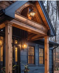 the front porch of a house with lights on