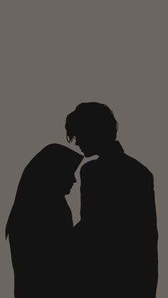 the silhouette of two people standing next to each other in front of a gray background