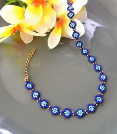 This beaded classy evil eye necklace/choker/bracelet is perfect for brightening up your holiday. Each necklace/bracelet includes a extender chain, adding 2 more inches to the original length. If you would like a different length or color, feel free to send me a message. - Thank you for visiting MannatDesignCo! I am honored that you have chosen to support me as an independent jewelry artist. - Please follow my Esty Page - Follow me on Instagram for updates on new designs and collections @mannat_designco - Follow me on Facebook @MannatDesignCo Handmade Blue Evil Eye Bracelet For Festival, Festival Beaded Evil Eye Bracelet, Blue Evil Eye Bracelet With Round Beads, Handmade Blue Evil Eye Bracelet With Round Beads, Bohemian Blue Beaded Necklaces With Evil Eye, Blue Beaded Necklaces With Evil Eye For The Beach, Blue Evil Eye Beaded Necklace For Beach, Blue Evil Eye Bracelet With Spacer Beads, Blue Evil Eye Bracelet With Round Spacer Beads