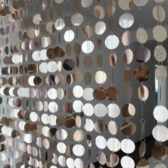 a wall with circles hanging from it's sides