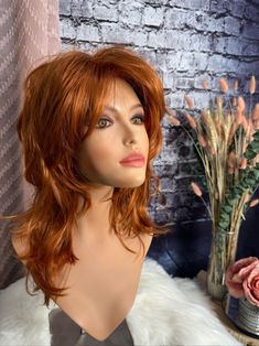 "This wig is life! For all those out there with a zest for life, loving that bold retro shag. Wear her bangs forward or sweep them off to the sides. Shake, tease and mist with Tressalure Wig Wax for volume and hold.  She has magnificent, steep layers throughout with lots of volume all over. Her color is a bright copper that works with light or dark eye colors! She fits heads up to 22\" with her fully machine made capless design and lots of permatease.  Fluff her up for a night out, smooth her down for a daytime look.  Two adjustable back straps, no combs or clips.  She measures 14\" at her longest with full layering and graduation.  Her fibers are low heat friendly up to 250 , moist heat only. You can give her a spritz of water and put in some hot rollers. Leave overnight.  She is as easy Moist Heat, Zest For Life, Hot Rollers, Bright Copper, Quality Wigs, Custom Wigs, Hair Replacement, Dark Eyes, Color Care