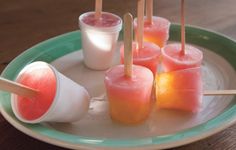 several popsicles are on a plate with toothpicks