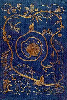 an intricately designed blue cloth with gold trimmings and flowers on the edges