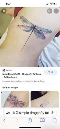 an image of a dragonfly tattoo on someone's stomach